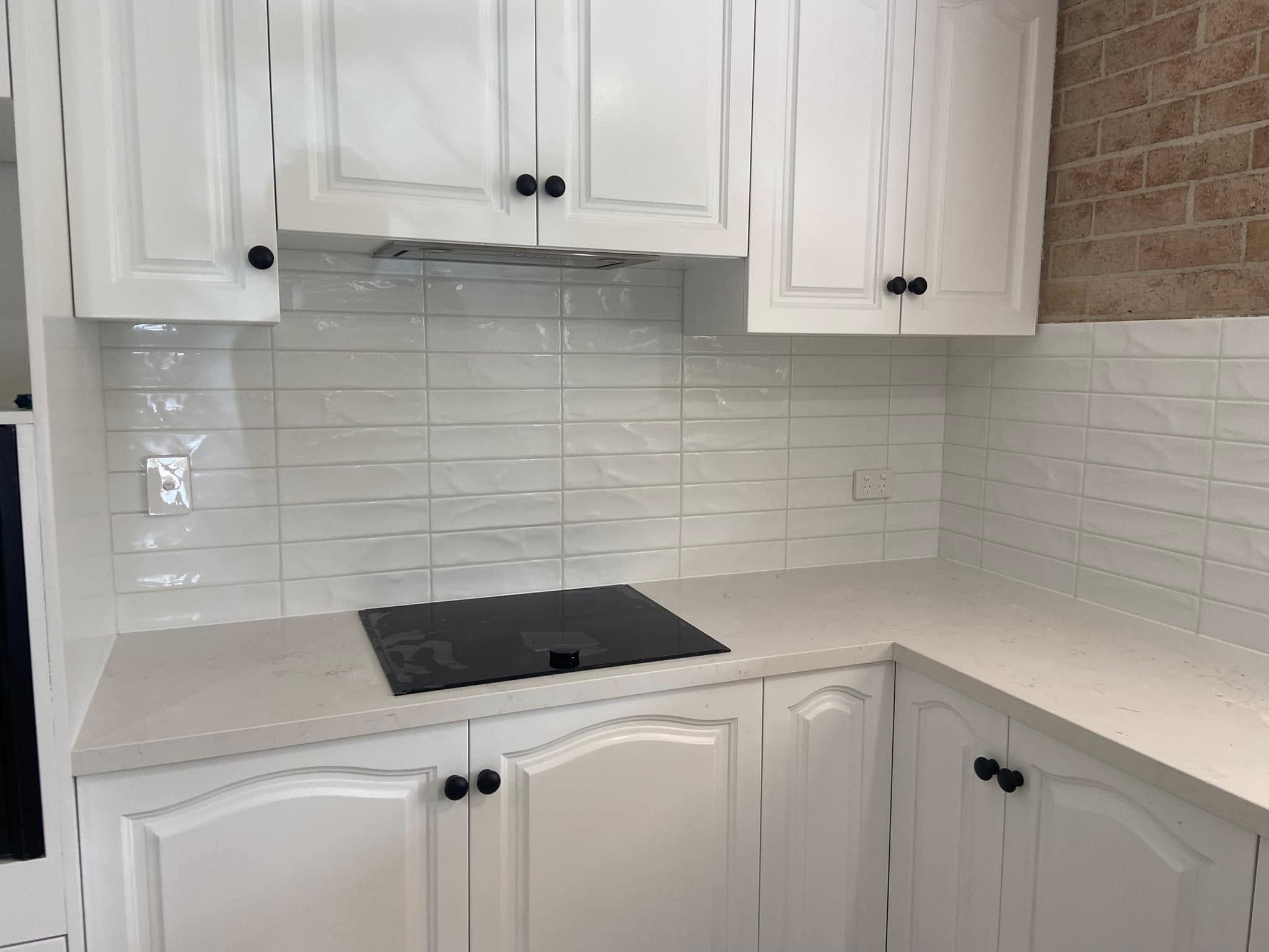 Styled kitchen with mosaic accent strip splashback